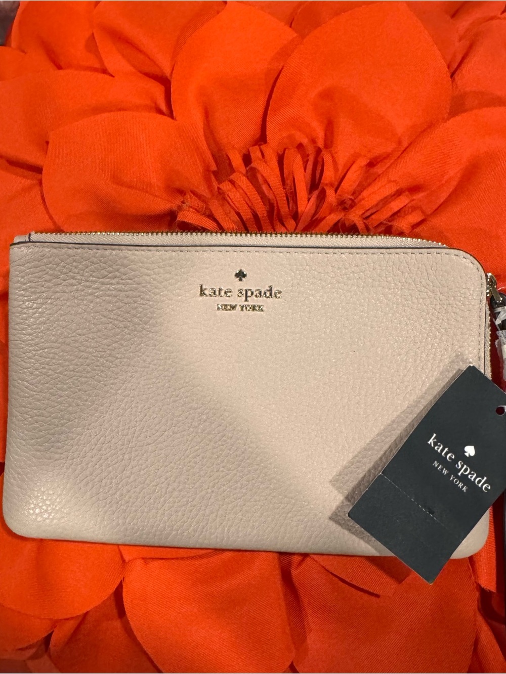 Kate spade Pebbled Leather wristlet in beige with Gold Logo; NWT